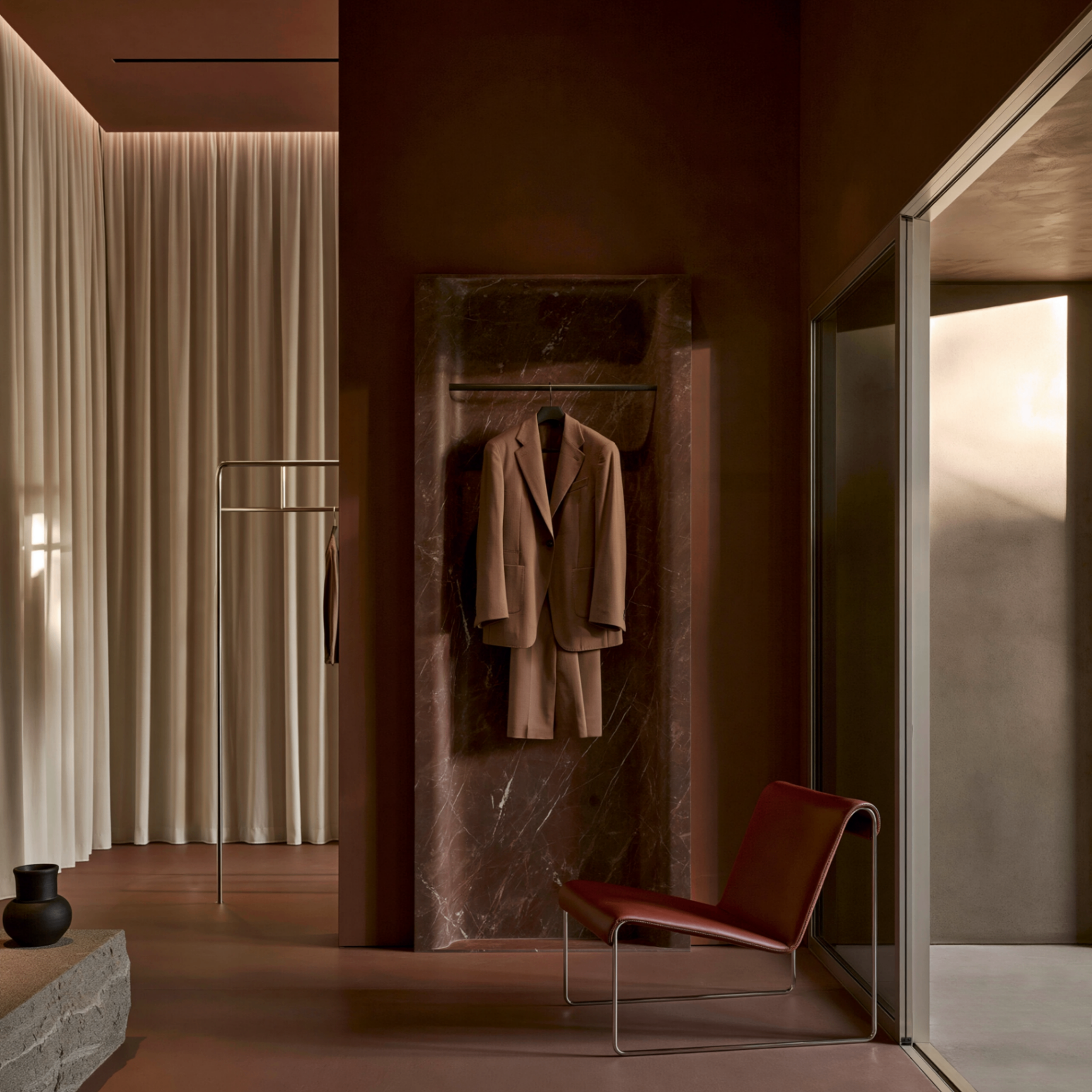 Atelier Rosso — a private dressing atelier in oxblood plaster and Rosso Levanto marble